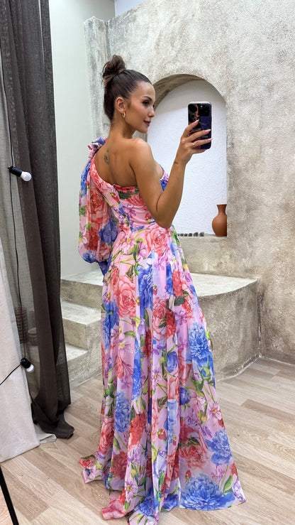 Woman in a colorful floral dress.